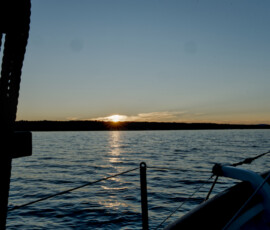 Sunset with a blue sky above, reflecting on the Atlantic Ocean.
